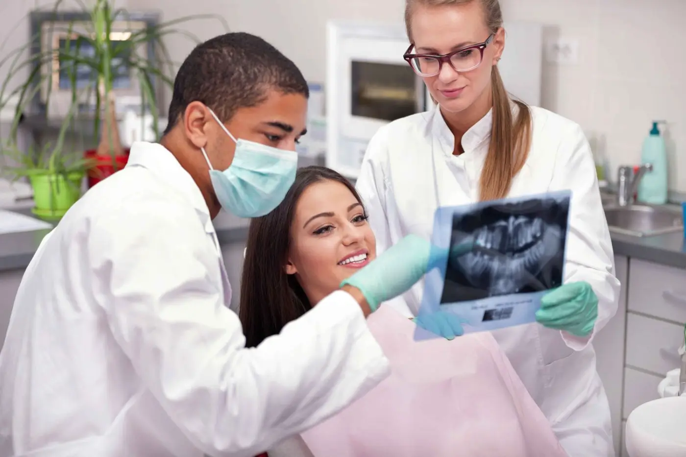 A clinician showing a patient her X-ray in the surgery